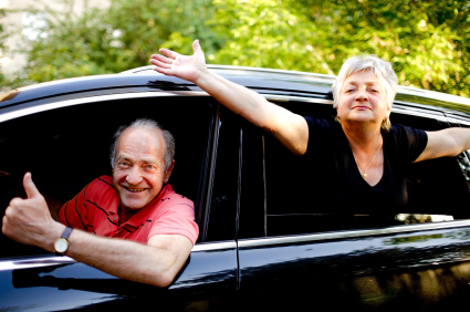 two older individuals in a car